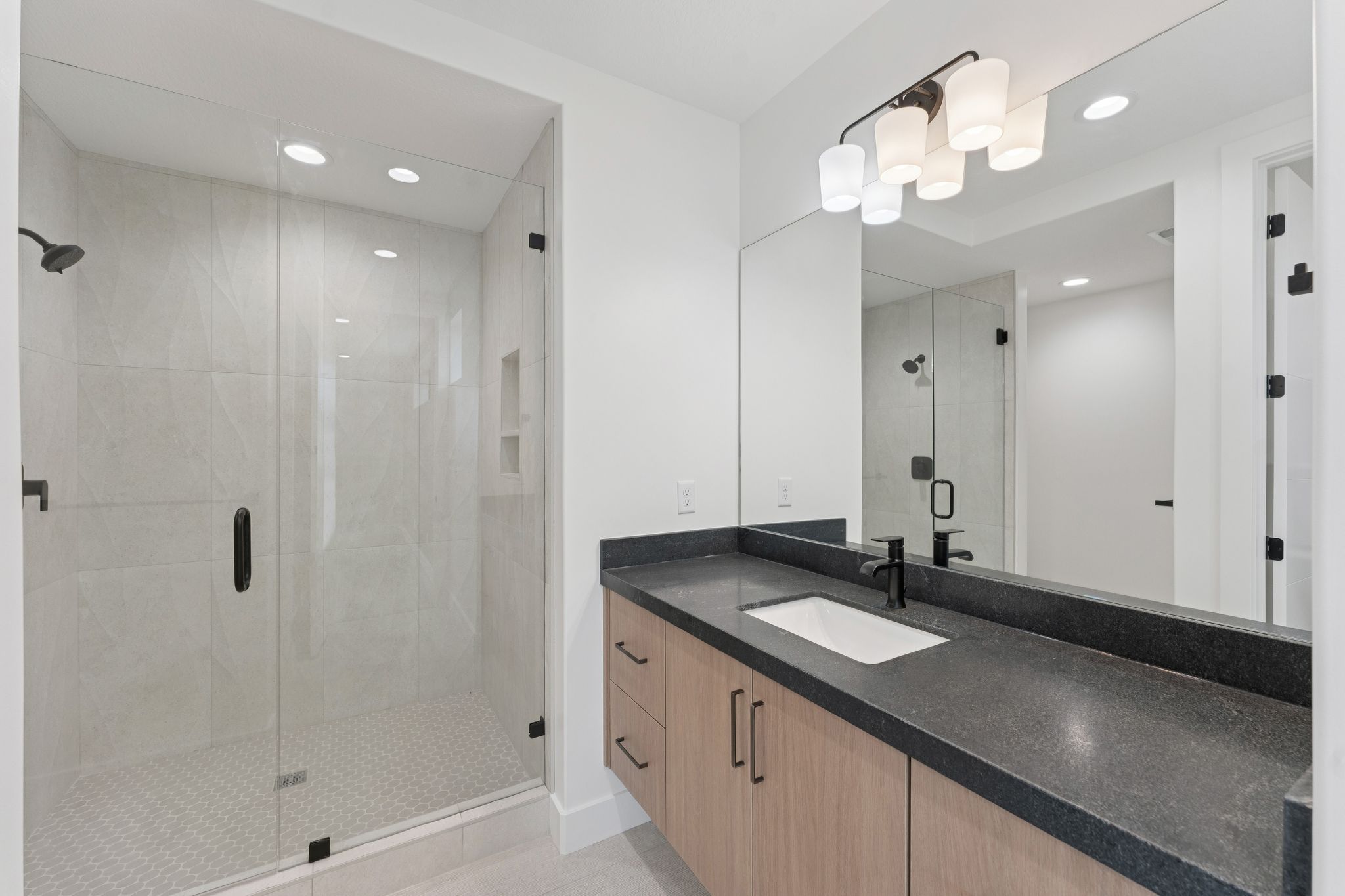 Full bathroom featuring vanity, a stall shower, recessed lighting, and tile patterned flooring
