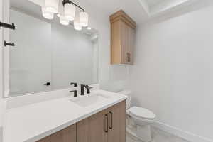 Bathroom with vanity and toilet