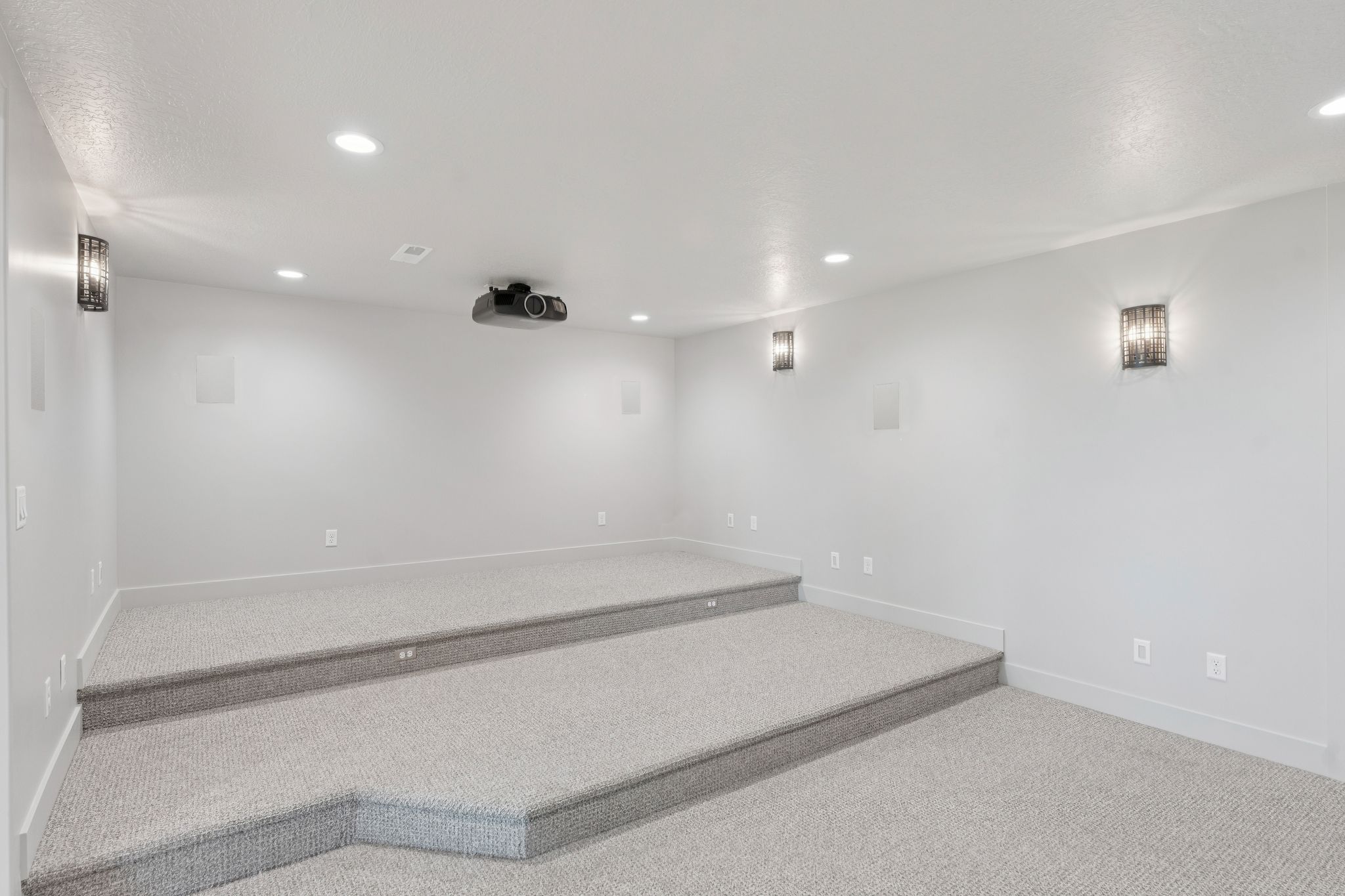 Carpeted spare room with recessed lighting