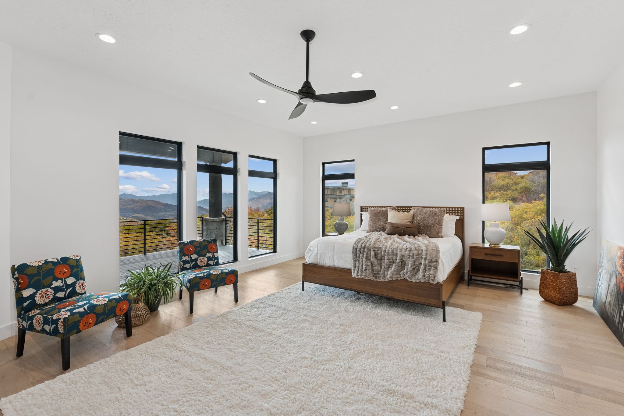 Bedroom featuring a mountain view, recessed lighting, light wood finished floors, and a ceiling fan