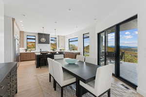 Dining room featuring light wood-style flooring and recessed lighting