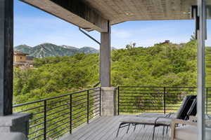 Wooden terrace featuring a mountain view