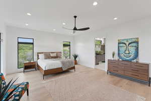 Bedroom featuring recessed lighting, light wood finished floors, ceiling fan, and ensuite bath