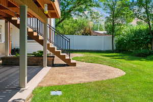 View of yard with stairs and a patio area