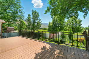 Wooden deck featuring a mountain view