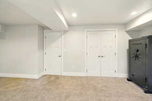 Unfurnished bedroom featuring carpet, a closet, and recessed lighting