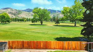View of property's community featuring a mountain view and golf course view