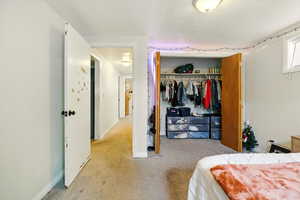 Bedroom with carpet flooring and a closet