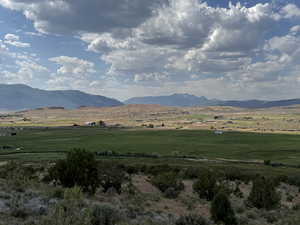 View of mountain background featuring rural landscape