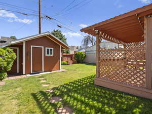 View of yard with a shed