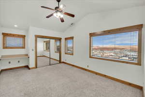 Unfurnished bedroom with carpet flooring, vaulted ceiling, a closet, recessed lighting, and a ceiling fan