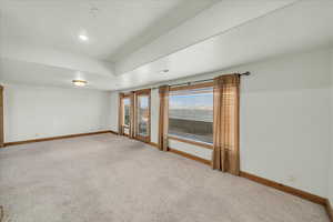 Spare room with light colored carpet