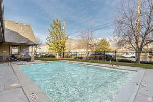Community pool featuring a patio area