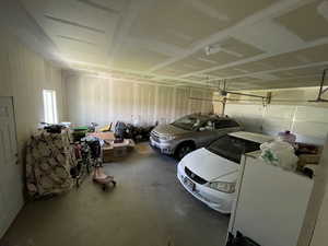 Garage featuring a garage door opener