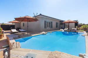 View of pool with a patio area