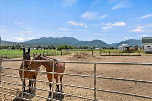 View of mountain backdrop with rural landscape