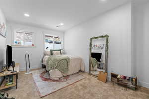 Carpeted bedroom featuring recessed lighting and baseboards