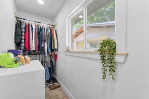 Walk in closet featuring carpet flooring