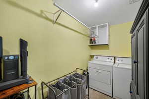 Laundry area with washer and clothes dryer