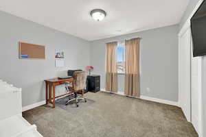 Bedroom 2 (currently being used as a home office). Includes the wall mounted TV and brackets!