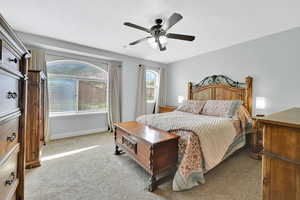 Spacious Primary Bedroom featuring carpet, flooring, ceiling fan and beautiful mountain views