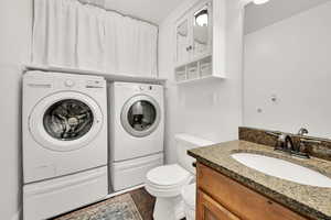 1/2 bathroom and laundry room, granite countertop, newer faucet, white cabinet is included