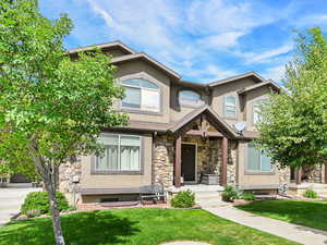 Enjoy the beautiful mountain views while relaxing on the covered porch. (Bench on front porch is included)