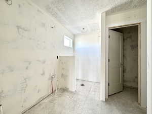 Bathroom with a textured ceiling