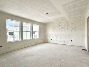 Empty room with a textured ceiling