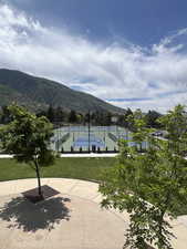 View of community with a tennis courts, pickleball courts, basketball and a mountain view