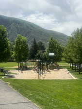 View of community with a mountain view and playground