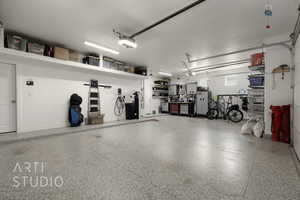 Garage featuring a garage door opener
