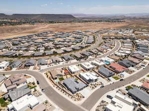 Aerial view of property's location with nearby suburban area and mountains