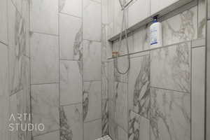 Bathroom view of a tile shower