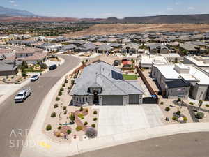 Aerial view of residential area featuring a mountainous background