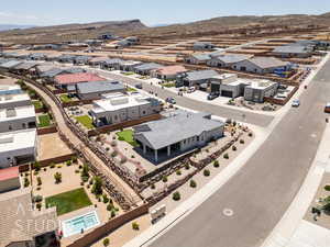 Aerial perspective of suburban area with a mountainous background