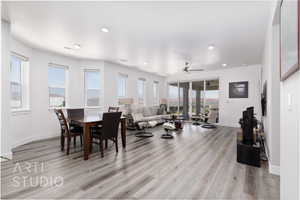 Dining space featuring light wood-style flooring, ceiling fan, and recessed lighting