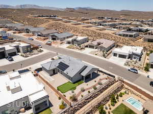 Aerial perspective of suburban area with a mountain backdrop