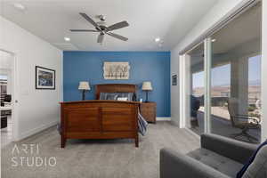 Bedroom with access to exterior, light colored carpet, multiple windows, and recessed lighting