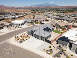 Aerial perspective of suburban area with a mountainous background