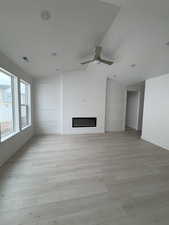 Living room featuring electric fireplace and accent wall