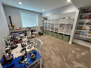 Carpeted home office featuring recessed lighting