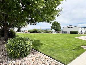 View of yard with a playground