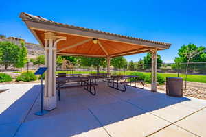 View of property's community with a gazebo and a patio