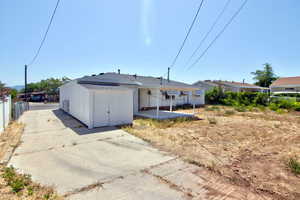 Back of house with a patio