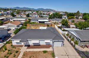 Aerial view of residential area with a mountainous background