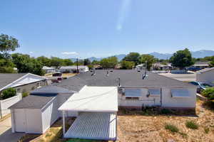 View of subject property with mountains