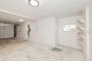 Garage featuring a garage door opener