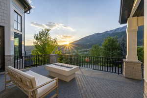 Patio / terrace featuring a mountain view and a fire pit