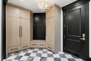 Entryway featuring a chandelier and light flooring